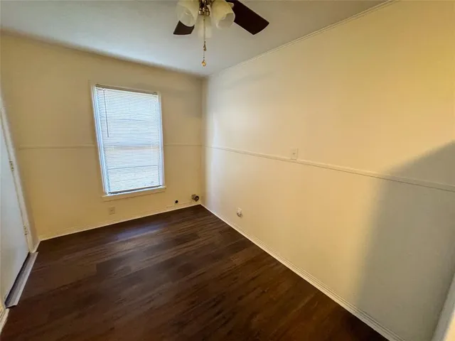 a view of a room with wooden floor and natural light