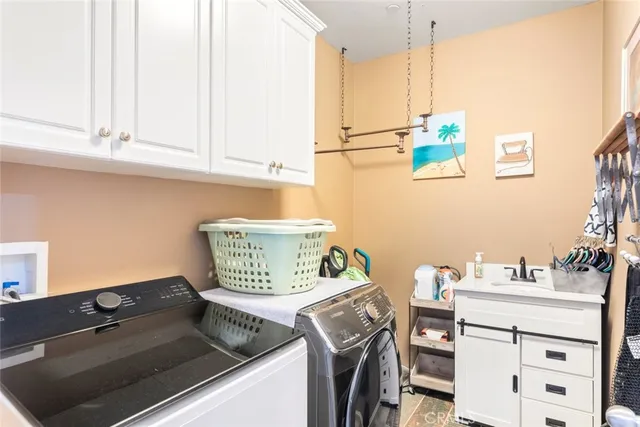 a kitchen with a stove and a white cabinet