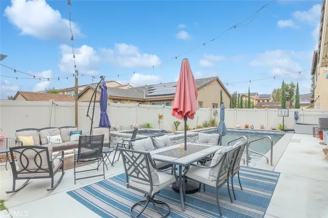a view of an outside dining space with furniture