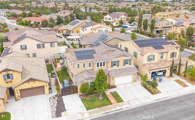 an aerial view of residential houses with outdoor space