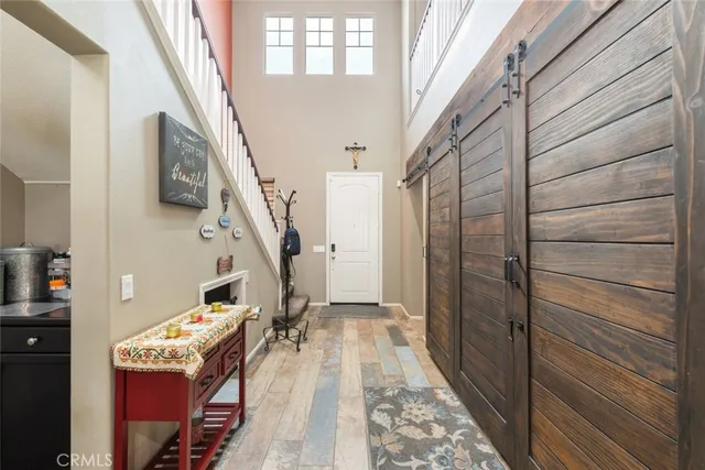 a view of an entryway with wooden floor