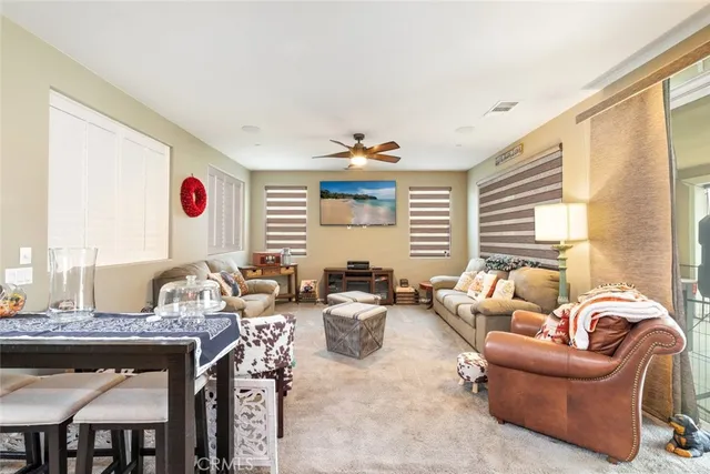 a very nice looking living room with furniture and a window