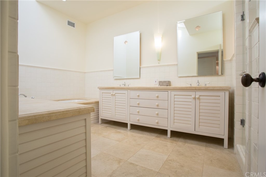 1 Seafaring Drive Corona del Mar, CA 92625 - Photo 17 of 25 a bathroom with a sink a vanity and a mirror