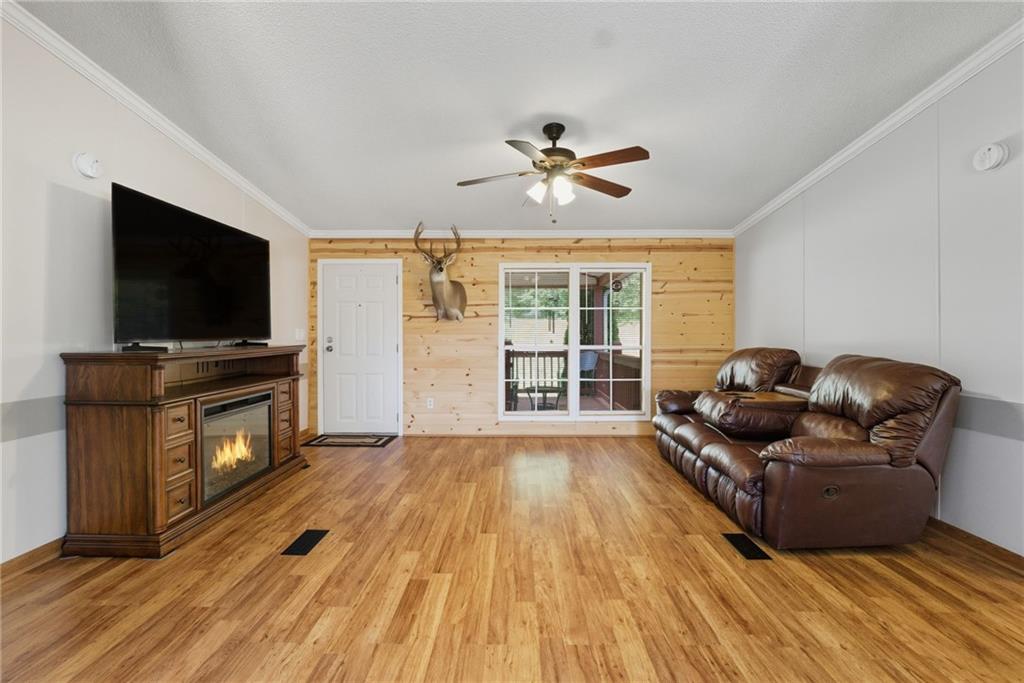 294 Old Ball Ground Road Canton, GA 30115 - Photo 13 of 40 a living room with furniture and a flat screen tv