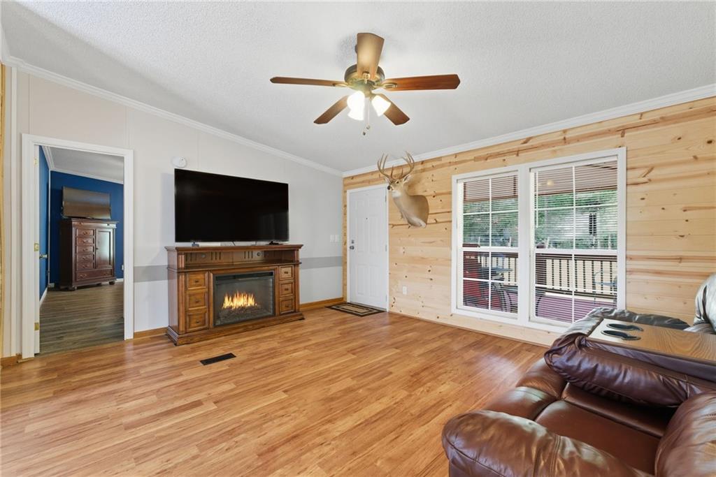 294 Old Ball Ground Road Canton, GA 30115 - Photo 14 of 40 a living room with furniture and a flat screen tv