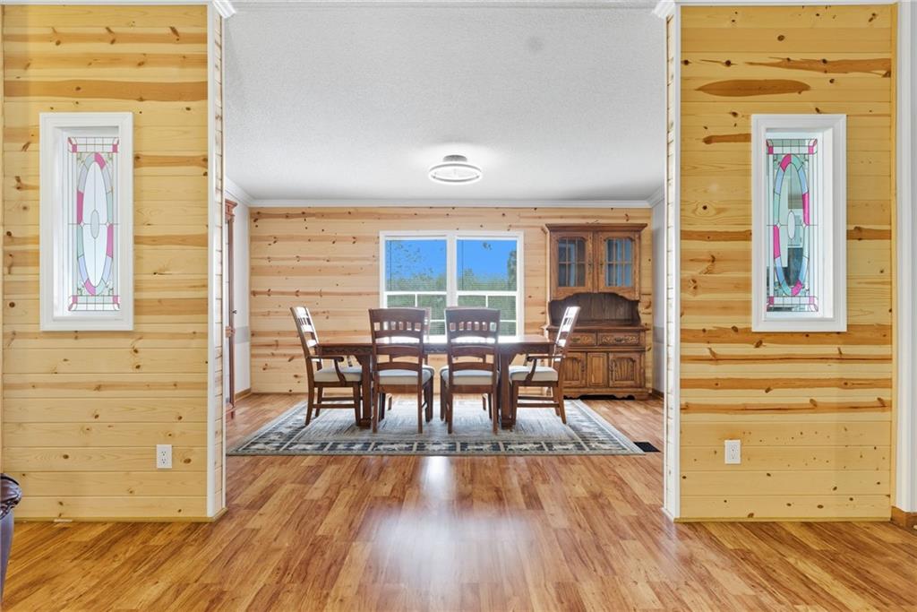 294 Old Ball Ground Road Canton, GA 30115 - Photo 16 of 40 a view of a dining room with furniture and wooden floor