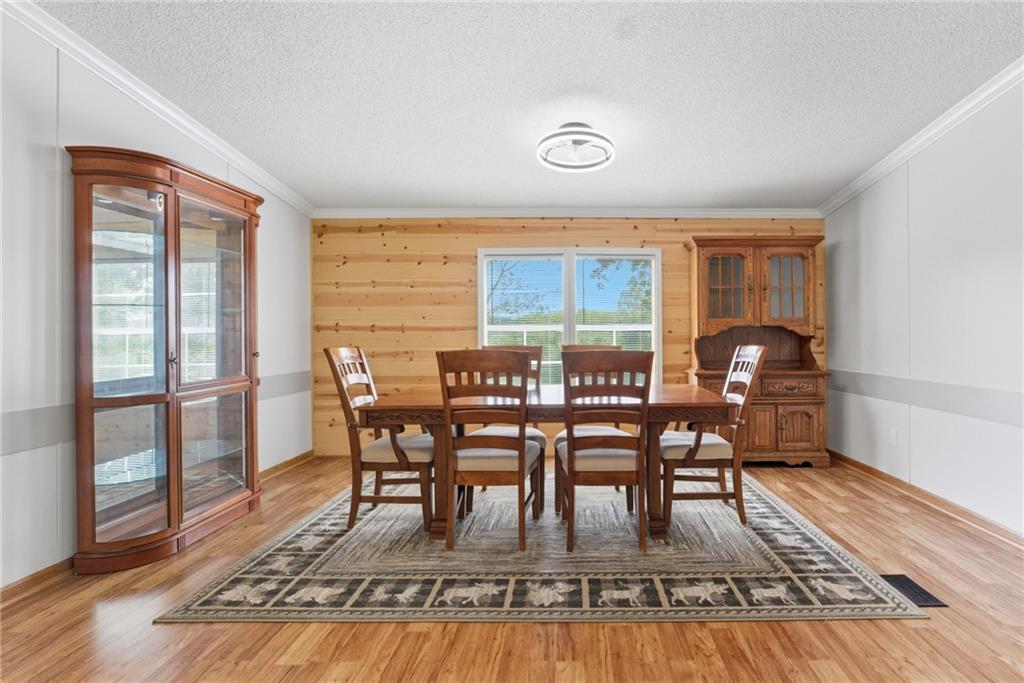 294 Old Ball Ground Road Canton, GA 30115 - Photo 17 of 40 a view of a dining room with furniture window and wooden floor