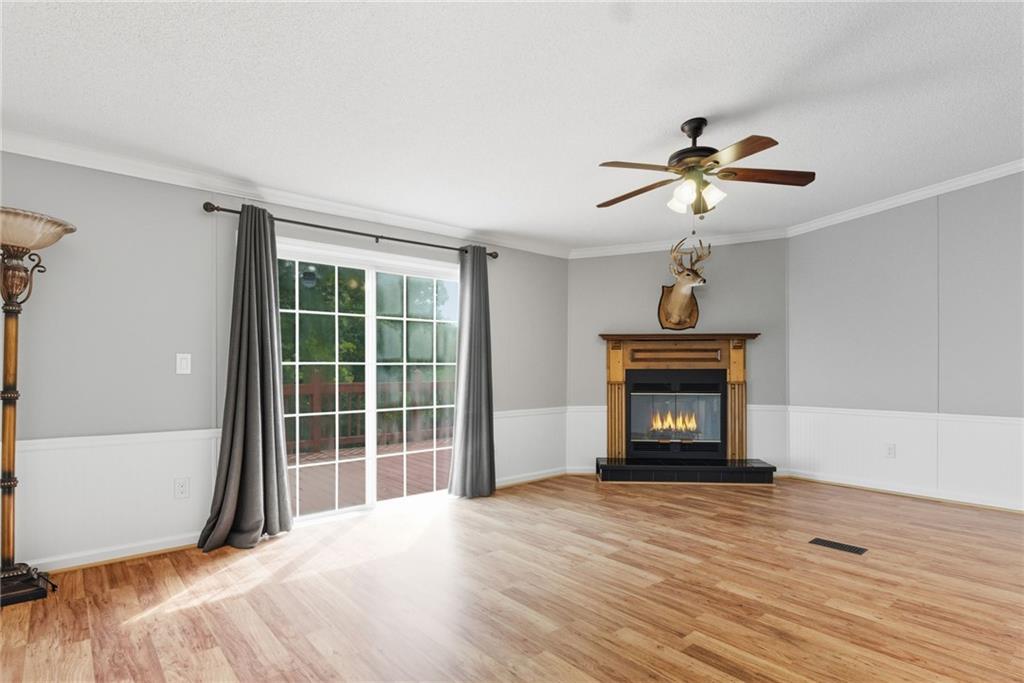 294 Old Ball Ground Road Canton, GA 30115 - Photo 23 of 40 a view of an empty room with a fireplace and a window