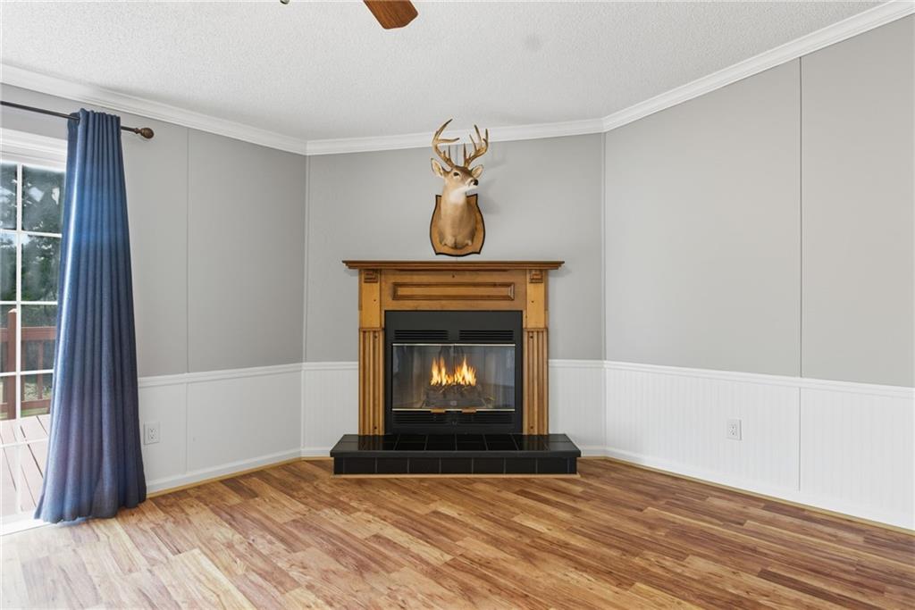 294 Old Ball Ground Road Canton, GA 30115 - Photo 25 of 40 a view of an empty room with wooden floor and a window