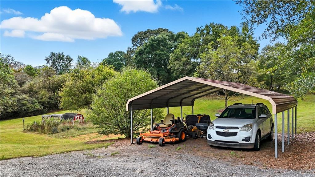 294 Old Ball Ground Road Canton, GA 30115 - Photo 3 of 40 a view of a car parked in front of a house