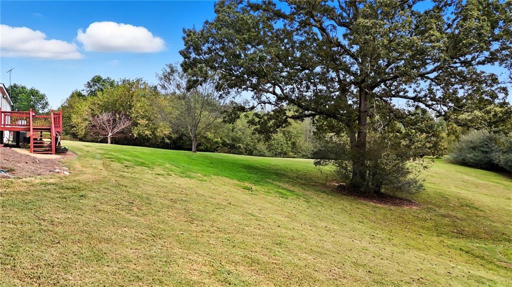 294 Old Ball Ground Road Canton, GA 30115 - Photo 10 of 40 a view of a field with an trees