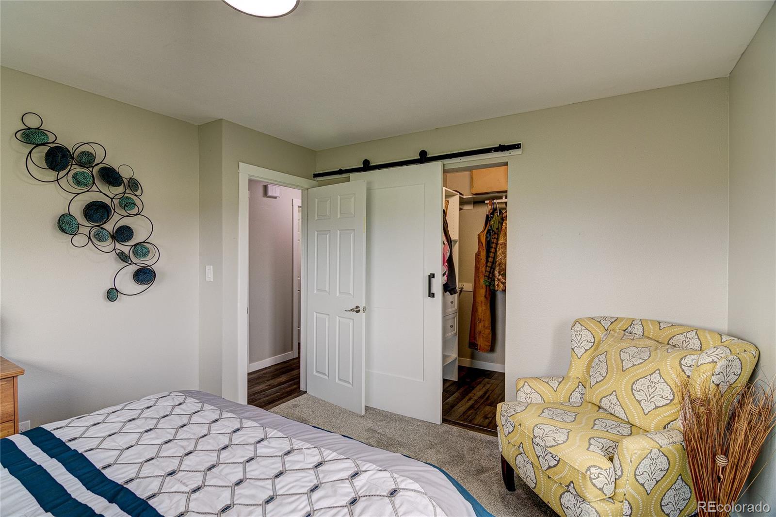 4531 East Best Road Larkspur, CO 80118 - Photo 20 of 49 a bedroom with a bed and a window