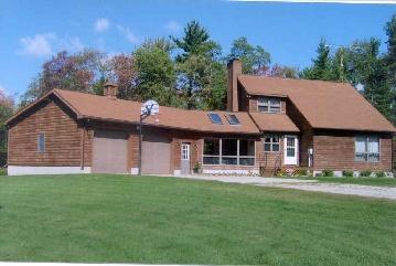 527 Wade Inn Road Becket, MA 01223 - Photo 1 of 1 a front view of a house with a yard