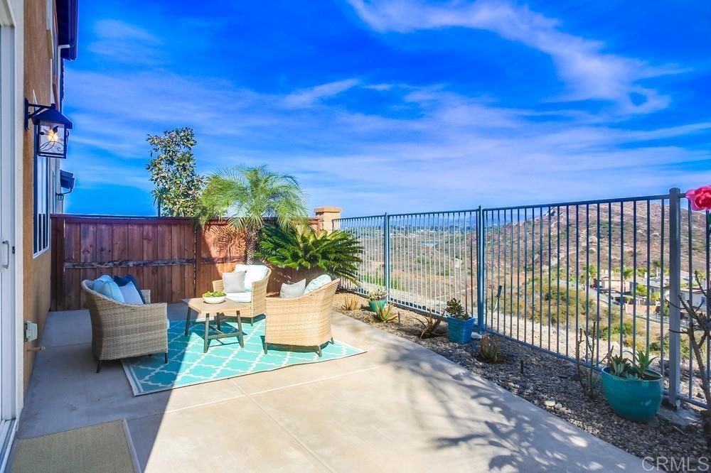 4142 Karst Road Carlsbad, CA 92010 - Photo 12 of 31 a view of a chair and tables in the patio