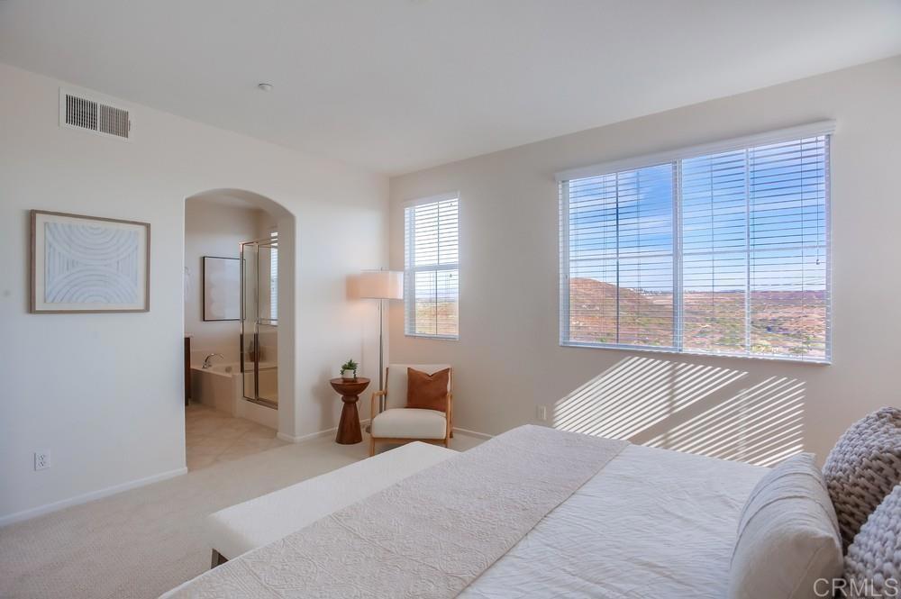 4142 Karst Road Carlsbad, CA 92010 - Photo 17 of 31 a bedroom with furniture and a large window