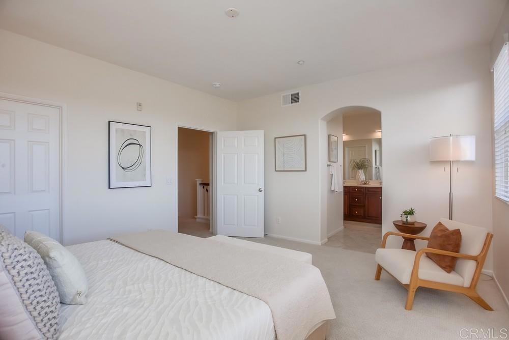 4142 Karst Road Carlsbad, CA 92010 - Photo 18 of 31 a bedroom with a bed and chair