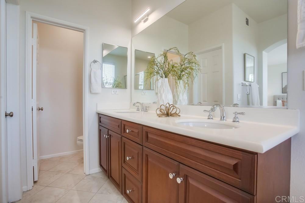4142 Karst Road Carlsbad, CA 92010 - Photo 19 of 31 a bathroom with a sink and a mirror
