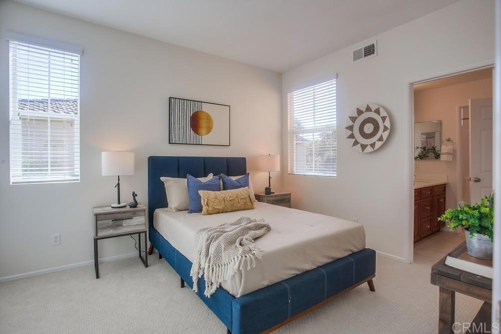 4142 Karst Road Carlsbad, CA 92010 - Photo 24 of 31 a bedroom with a bed and window