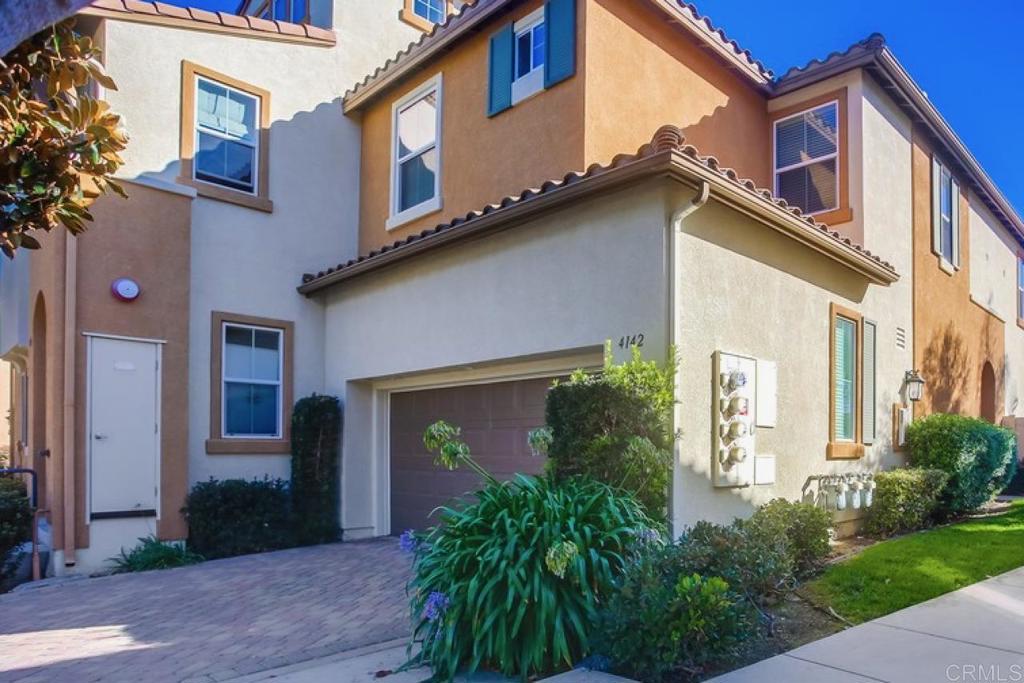 4142 Karst Road Carlsbad, CA 92010 - Photo 3 of 31 a view of a house with a yard and plants