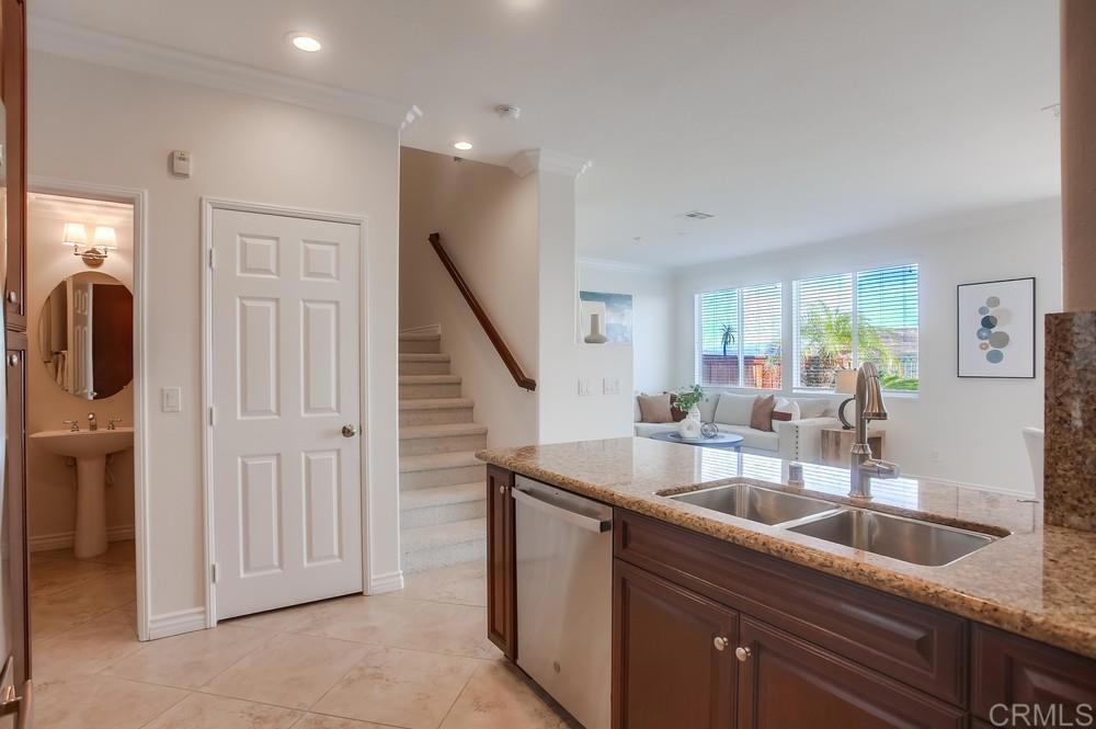 4142 Karst Road Carlsbad, CA 92010 - Photo 10 of 31 a kitchen with sink and refrigerator