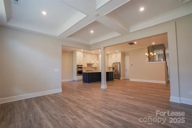 a view of a kitchen with a sink and a window
