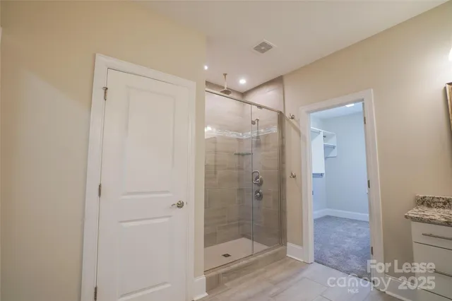 a bathroom with a shower and a toilet