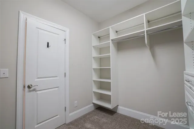 a view of an empty walk in closet