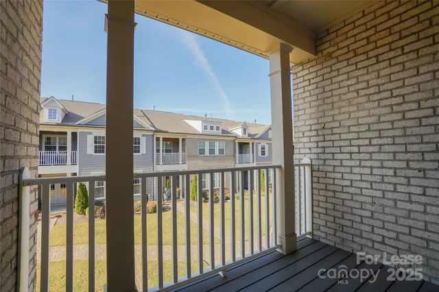 a view of a brick house with a street