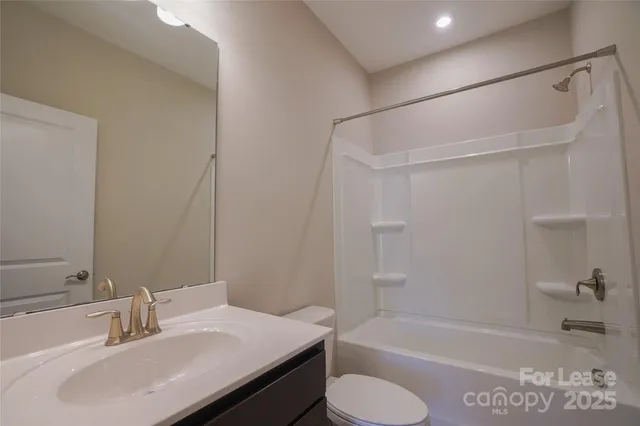 a bathroom with a sink toilet and bathtub