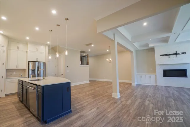 a view of a kitchen cabinets and a wooden floor