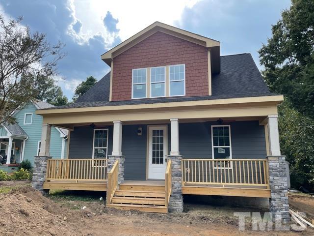 202 Myers Avenue Raleigh, NC 27604 - Photo 1 of 26 a front view of a house with a deck