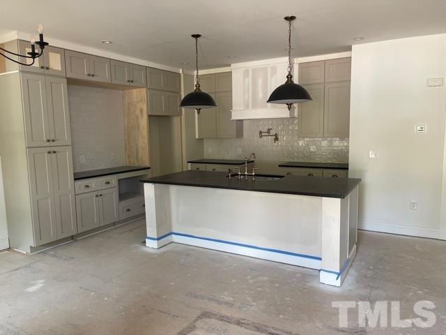 202 Myers Avenue Raleigh, NC 27604 - Photo 2 of 26 a front view of a kitchen with a stove and a shower