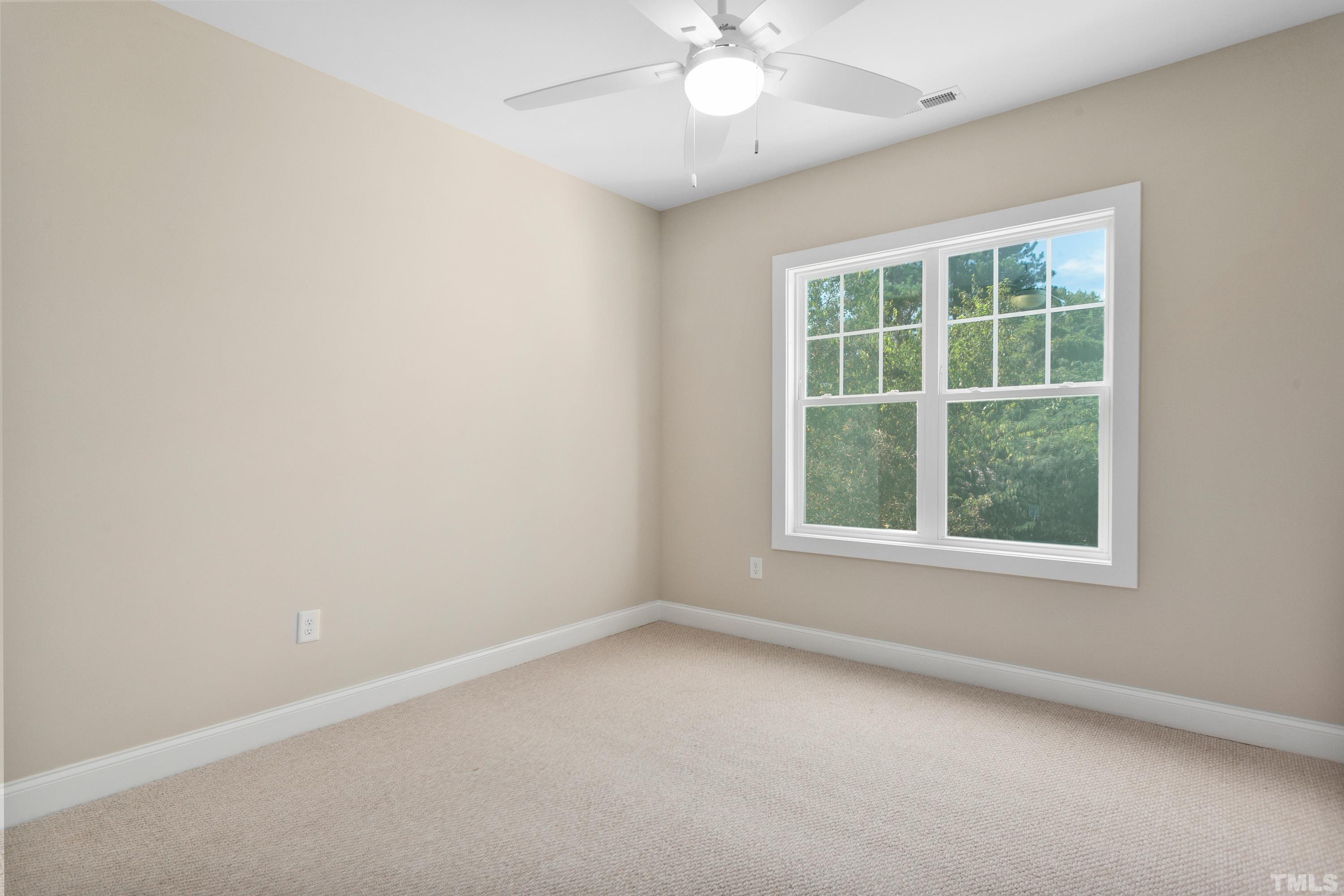 202 Myers Avenue Raleigh, NC 27604 - Photo 21 of 26 an empty room with a window