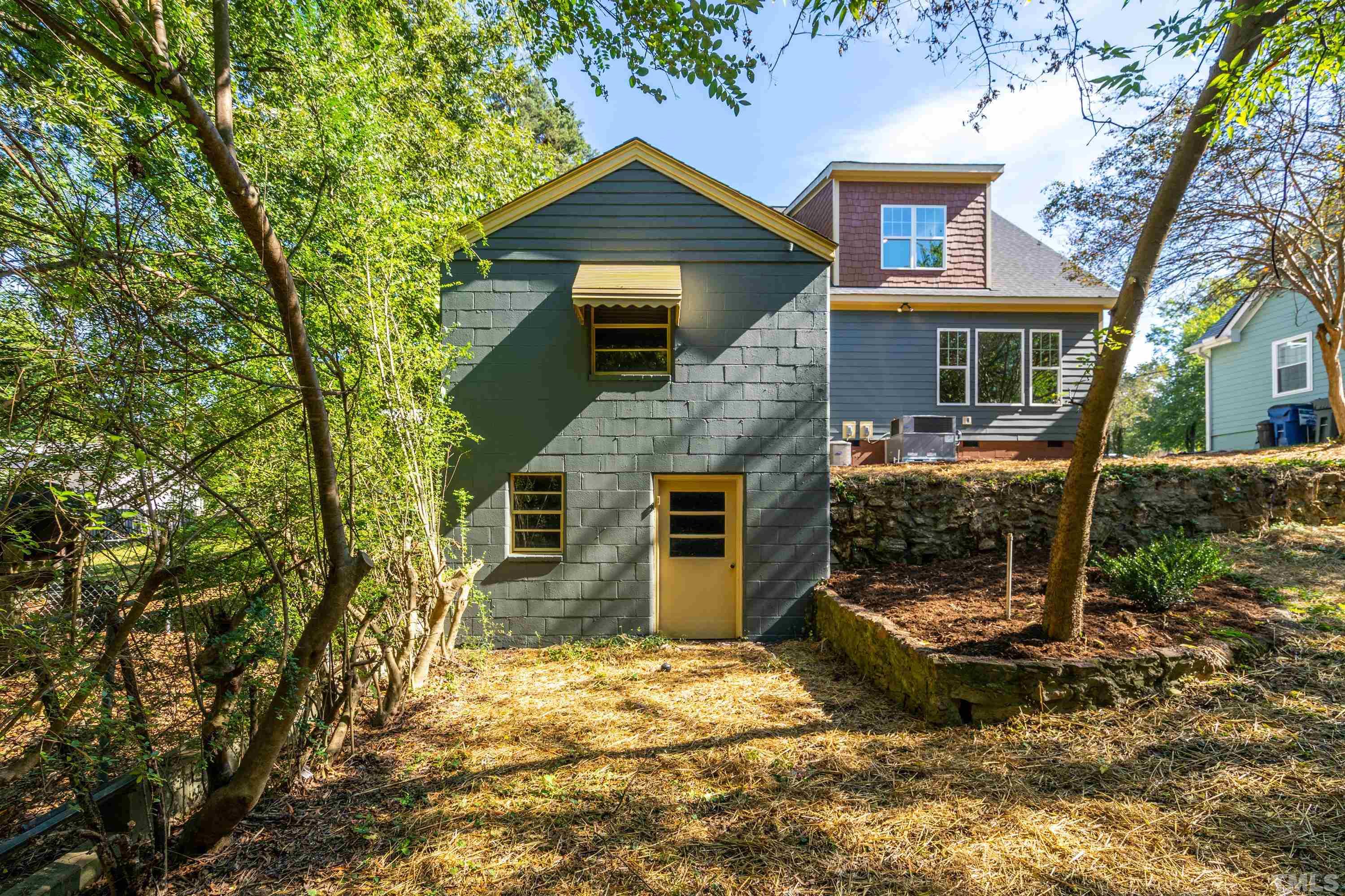 202 Myers Avenue Raleigh, NC 27604 - Photo 24 of 26 a front view of a house with garden
