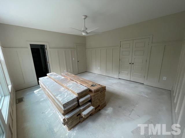 202 Myers Avenue Raleigh, NC 27604 - Photo 5 of 26 a room with a bed and a mirror