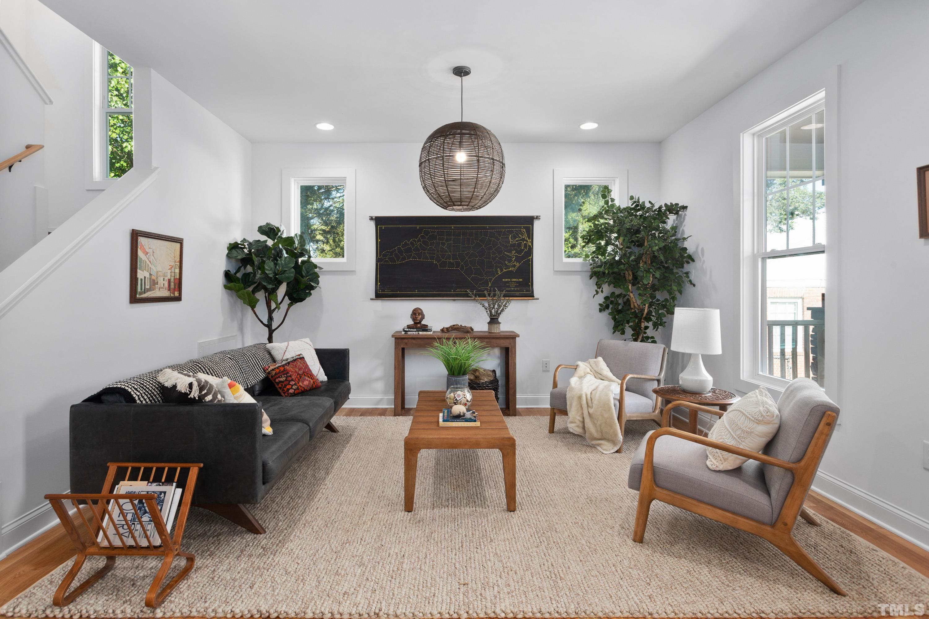 202 Myers Avenue Raleigh, NC 27604 - Photo 10 of 26 a living room with furniture and a potted plant