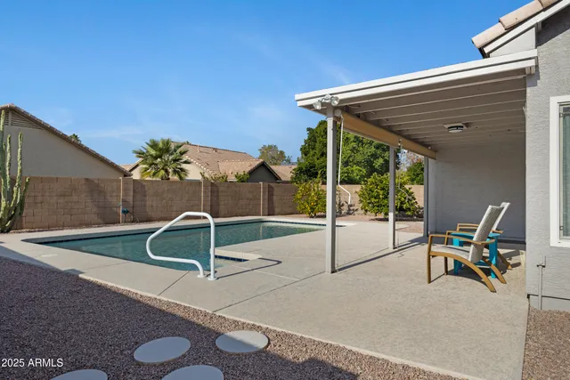 a patio with table and chairs