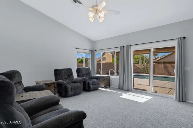 a living room with furniture and a window