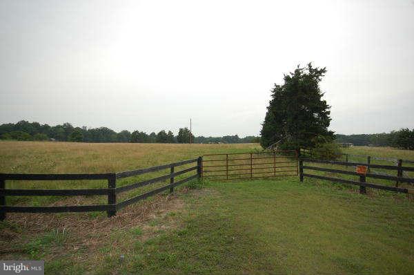 5320 Turkey Run Road Warrenton, VA 20187 - Photo 2 of 16 a view of a bench in front of lake