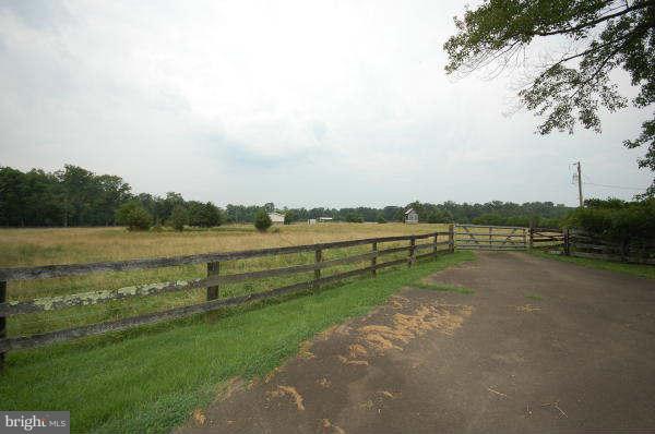 5320 Turkey Run Road Warrenton, VA 20187 - Photo 8 of 16 a view of a lake with houses in the back
