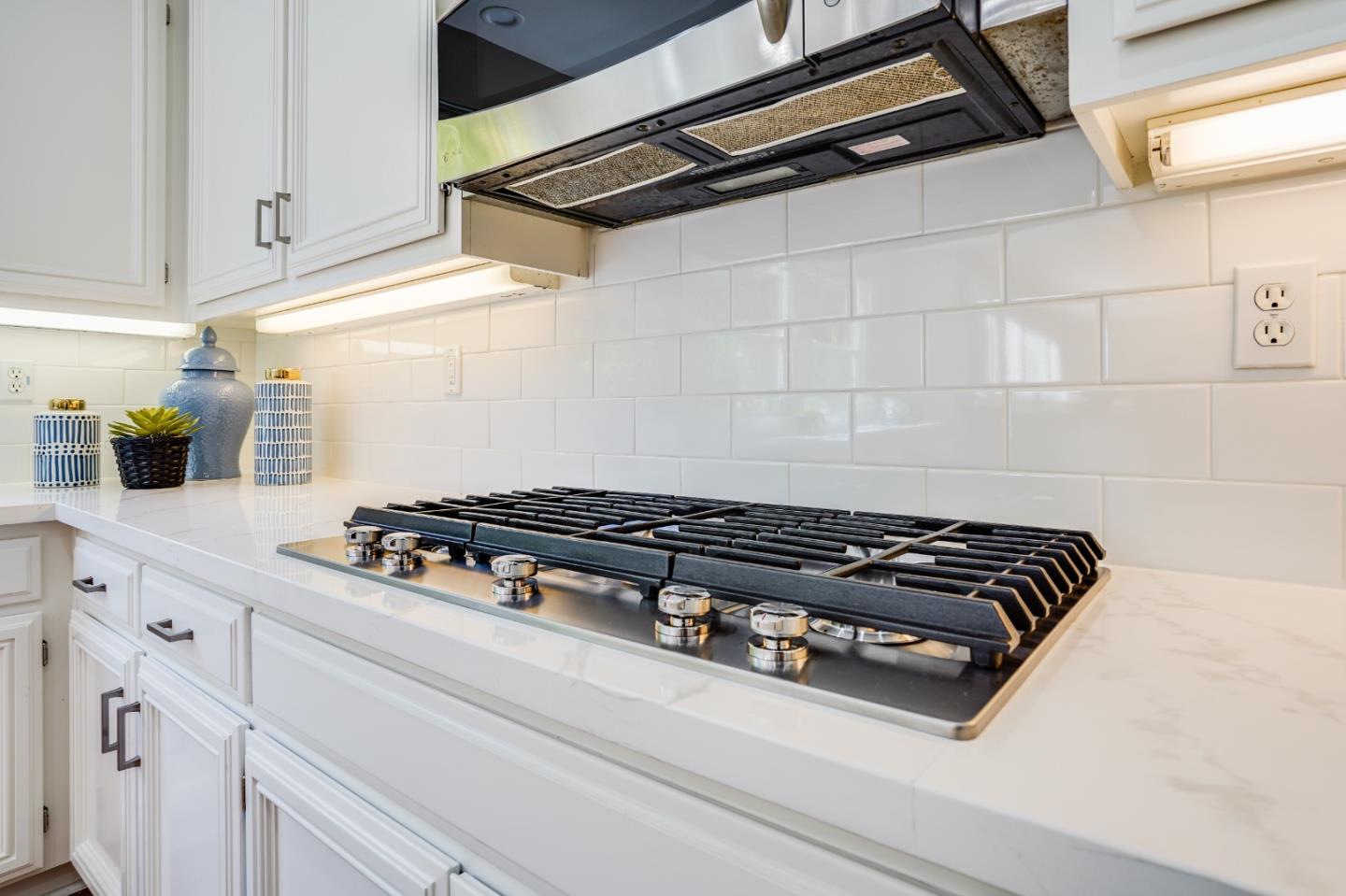 5929 Lantana Way San Ramon, CA 94582 - Photo 16 of 61 a close view of a stove a microwave and cabinets