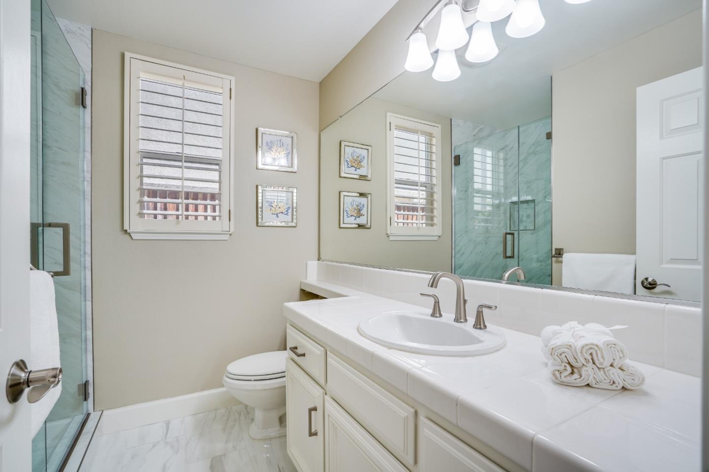 5929 Lantana Way San Ramon, CA 94582 - Photo 24 of 61 a bathroom with a sink a toilet and a mirror