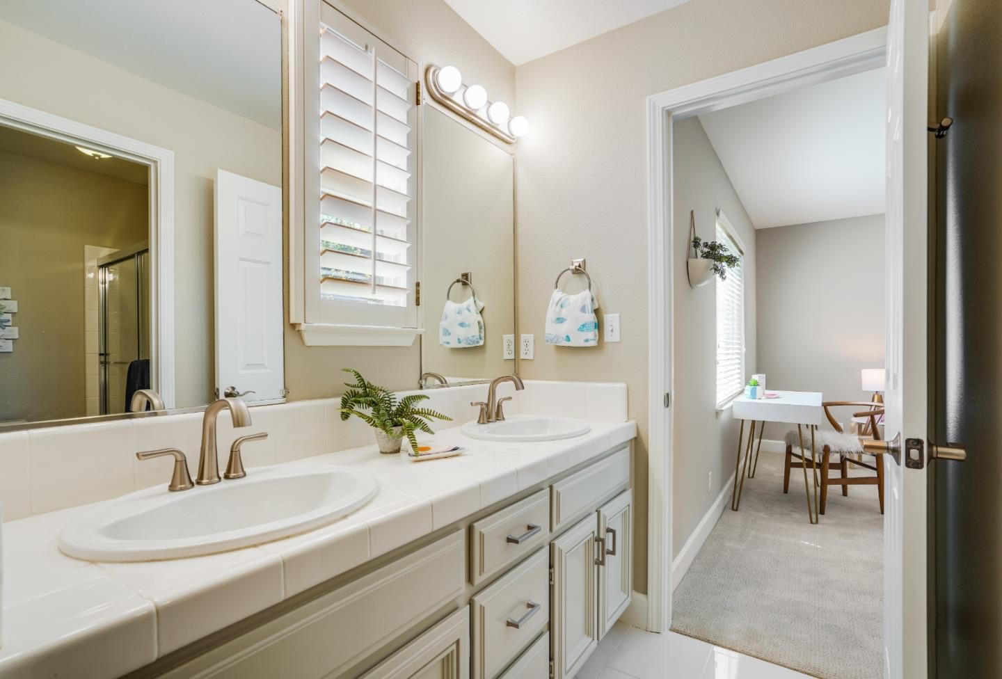 5929 Lantana Way San Ramon, CA 94582 - Photo 40 of 61 a bathroom with a double vanity sink mirror and a bathtub