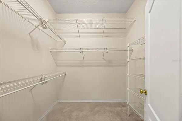 a spacious bathroom with a double vanity sink a mirror and a bathtub