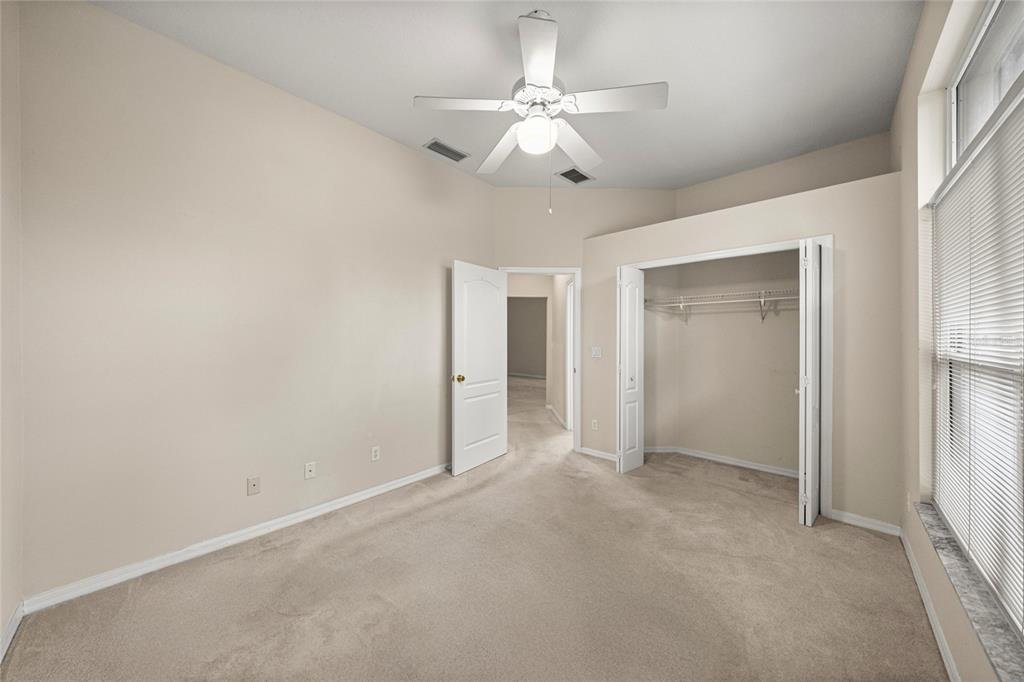 20698 Southwest 93rd Lane Road Dunnellon, FL 34431 - Photo 23 of 34 an empty room with fan and entrance