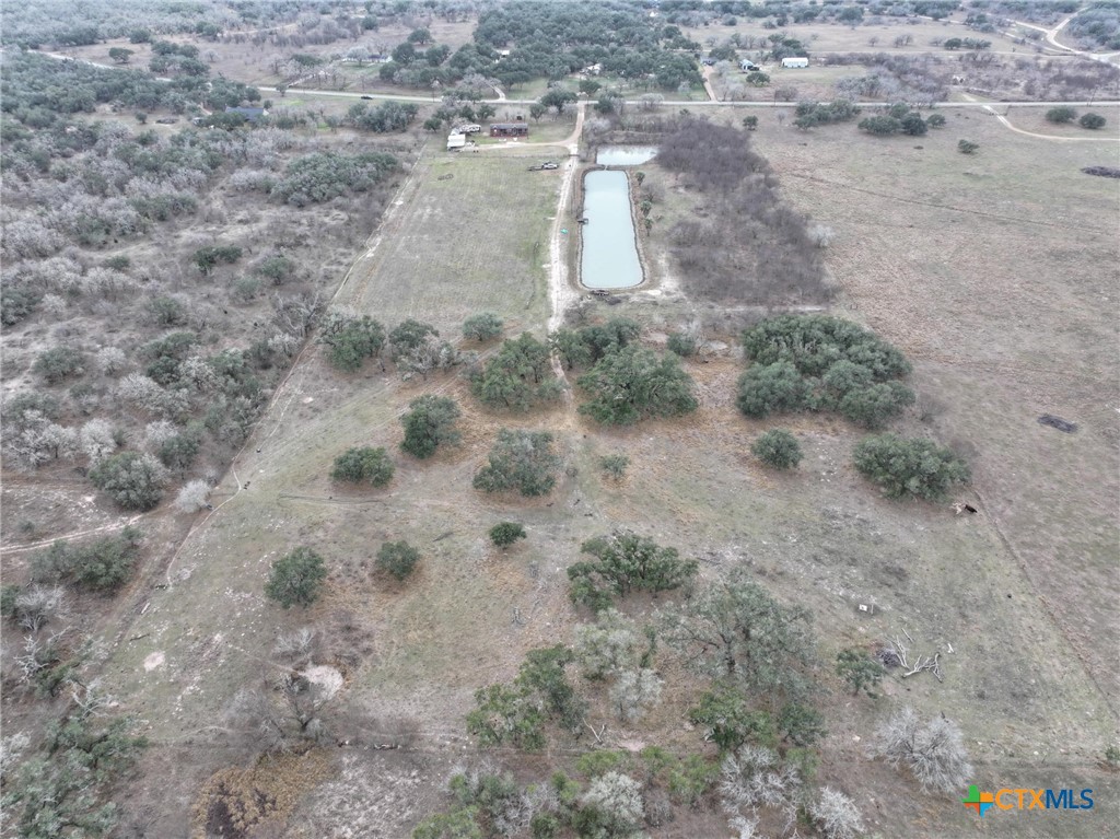 1385 Bego Road Goliad, TX 77963 - Photo 8 of 41 a view of a dry yard with wooden floor