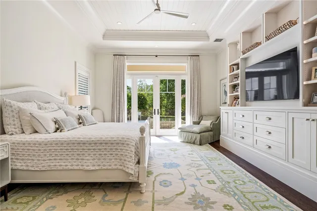 a bedroom with a bed a couch and dresser