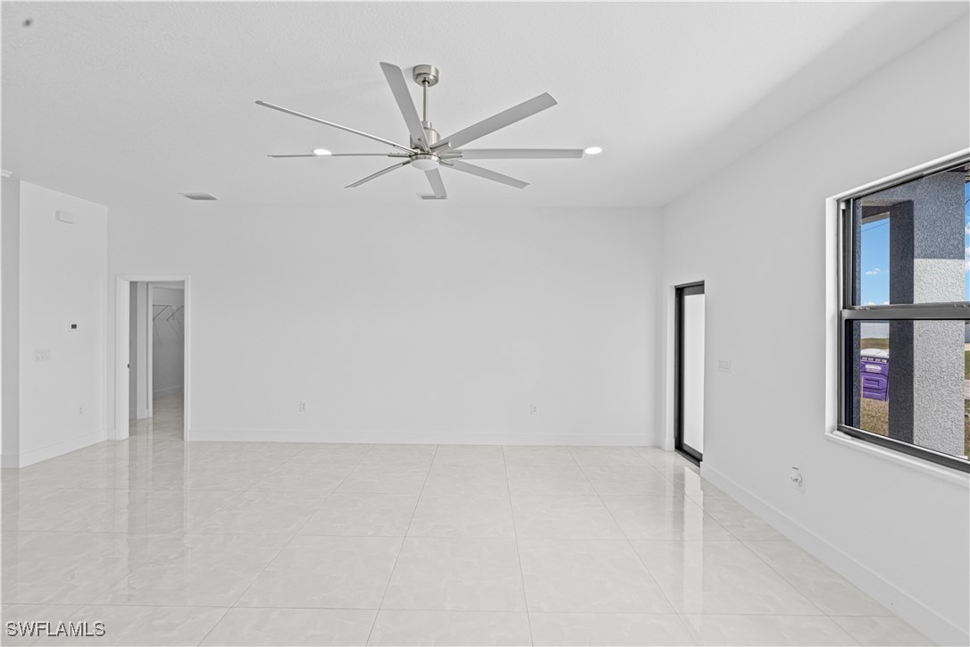 7029 Hero Court LaBelle, FL 33935 - Photo 13 of 36 an empty room with closet and a ceiling fan