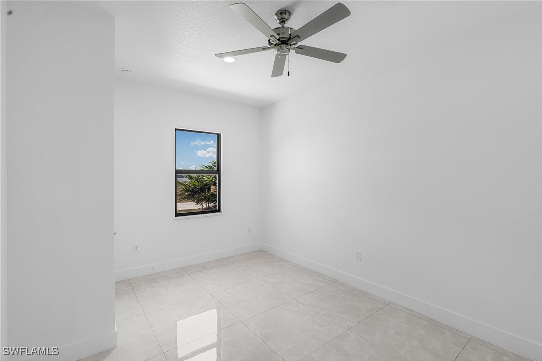 7029 Hero Court LaBelle, FL 33935 - Photo 20 of 36 an empty room with a window and a fan