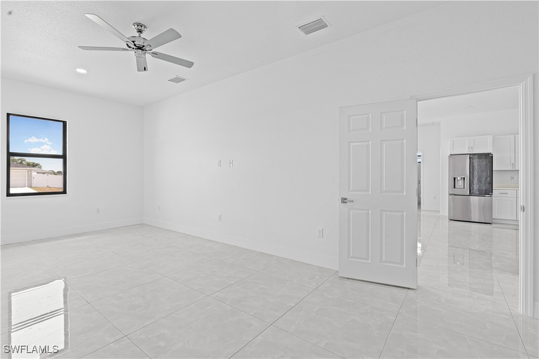 7029 Hero Court LaBelle, FL 33935 - Photo 26 of 36 wooden floor in an empty room with a window